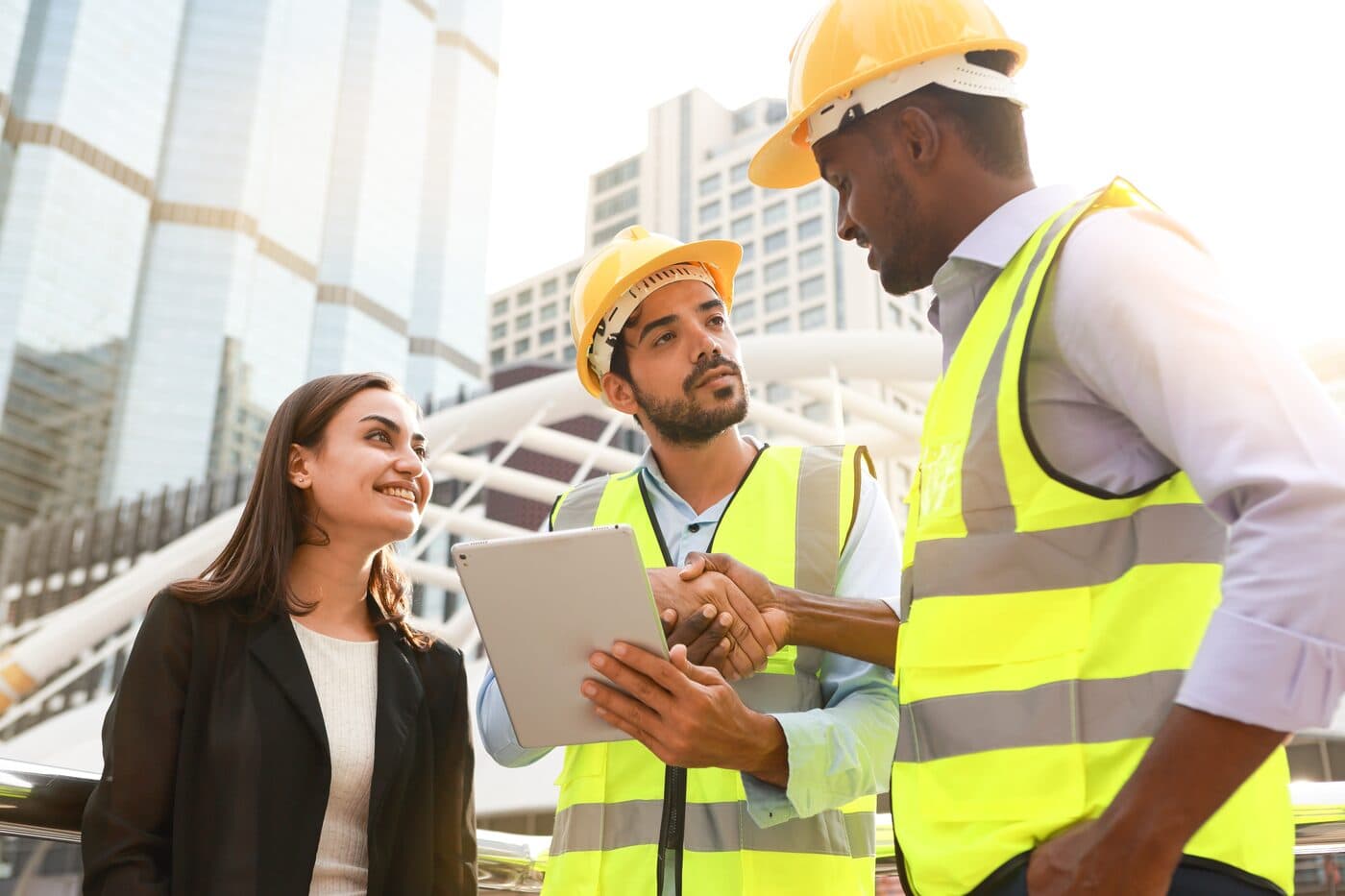 Contractor shaking hands with a client on a construction site